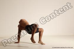 Underwear Gymnastic poses Man Black Muscular Bald Dancing Dynamic poses Academic